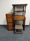 An early 20th century oak single pedestal desk together with an oak occasional table and a rattan