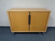 A mid 20th century Danish System B8 shutter door office stationary cabinet (no shelves)