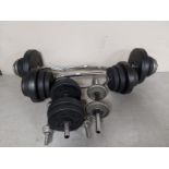 Four dumbbells and two barbells together with various weights