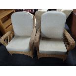 A pair of wicker conservatory armchairs