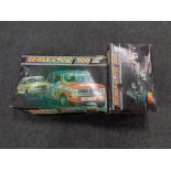 A boxed Scalextric 300 electric model racing set complete with cars,