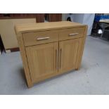 An oak effect cabinet fitted cupboards and drawers