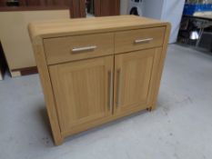 An oak effect cabinet fitted cupboards and drawers