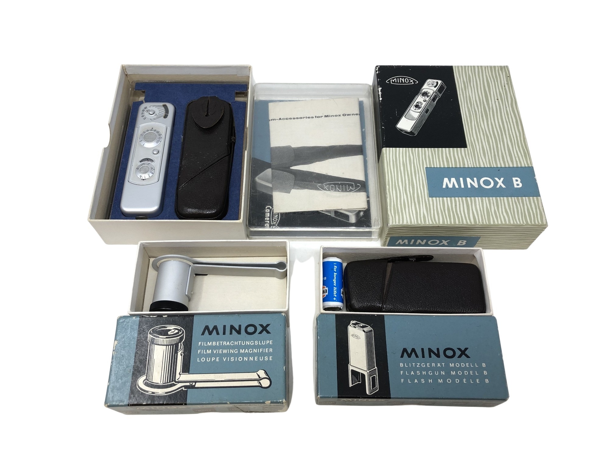 A Minox Flashgun Model B, together with a Film Viewing Magnifier and a Minox B camera.