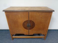 An early 20th century oak double door cupboard,