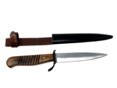 A German boot knife in sheath.