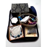 A tray containing jewellery boxes containing assorted costume jewellery, plated cigarette case,