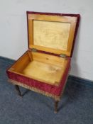 An upholstered workbox/ stool on carved beech legs