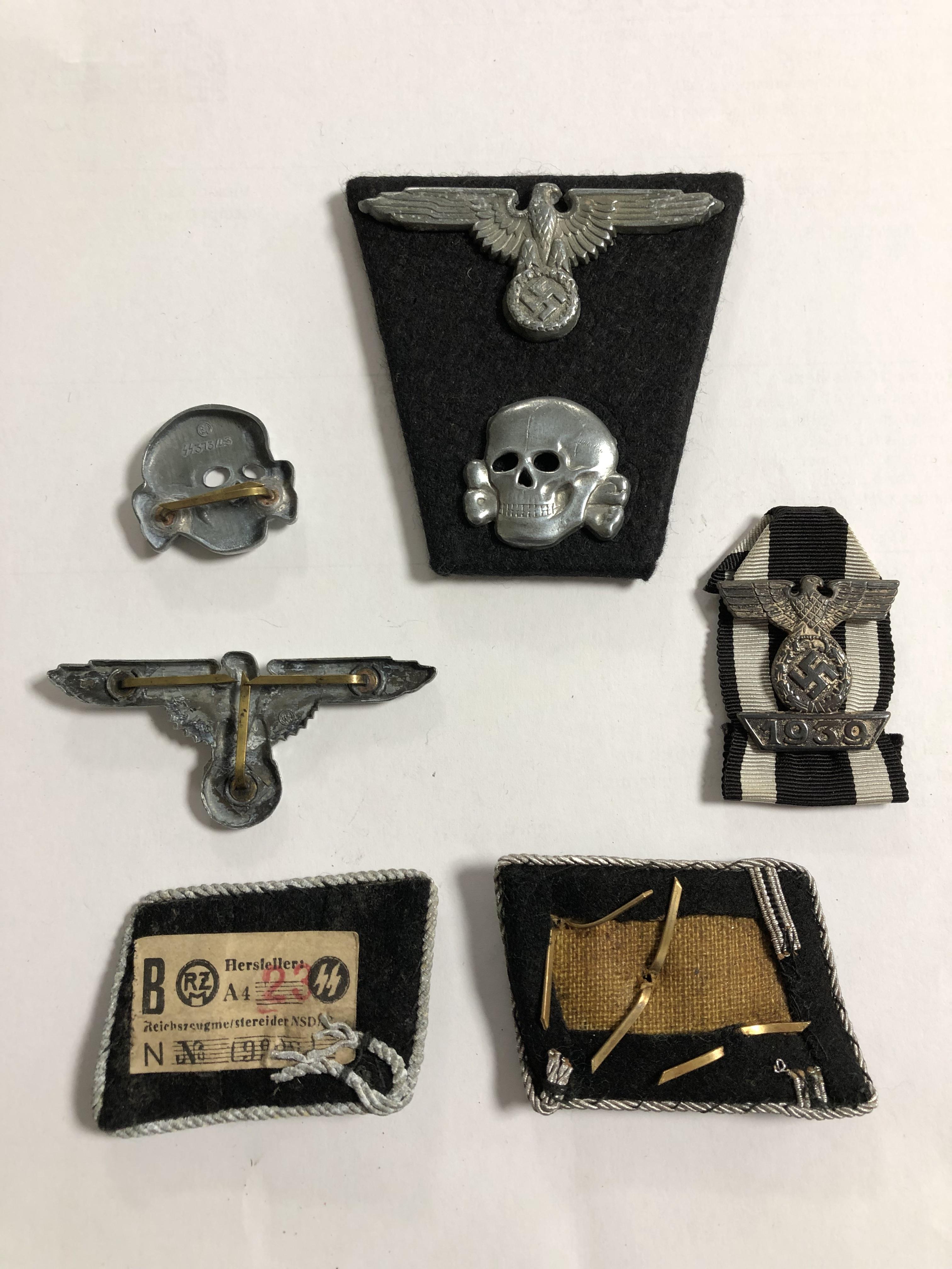 A group of German insignia including two Totenkopf skull cap badges, two eagle cap badges, - Image 2 of 8