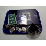 A tray containing assorted coinage to include crowns, coin collector's albums, foreign coinage,