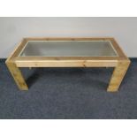 A reclaimed pine glass topped coffee table