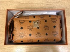 A lady's MCM leather hand bag in box with purchase receipts and dust cover