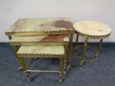 A nest of three brass and onyx tables together with a similar wine table