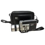 A Canon Auto Zoom 814 cine camera in carry bag.