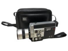 A Canon Auto Zoom 814 cine camera in carry bag.