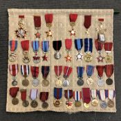 Approximately thirty-seven reproduction medals and badges of Russian/ Eastern European interest