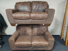 A pair of brown suede leather two seater settees