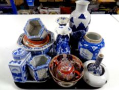 A tray containing antique oriental blue and white porcelain vases, imari teapot,