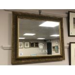 A gilt framed mirror 'Rolex', inscribed verso 'Goldsmiths Notts',