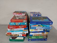 A large quantity of assorted jigsaws and puzzles