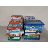 A large quantity of assorted jigsaws and puzzles