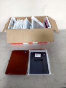 A box containing new phone and tablet protective covers