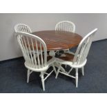 A Laura Ashley French style shabby chic circular pedestal dining table together with four spindle