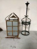 An early 20th century brass hanging hall lantern with frosted glass panels together with a further