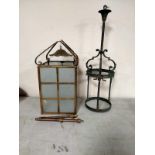 An early 20th century brass hanging hall lantern with frosted glass panels together with a further