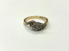 An 18ct gold diamond set crossover ring, size O. CONDITION REPORT: 3.6g.