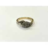 An 18ct gold diamond set crossover ring, size O. CONDITION REPORT: 3.6g.