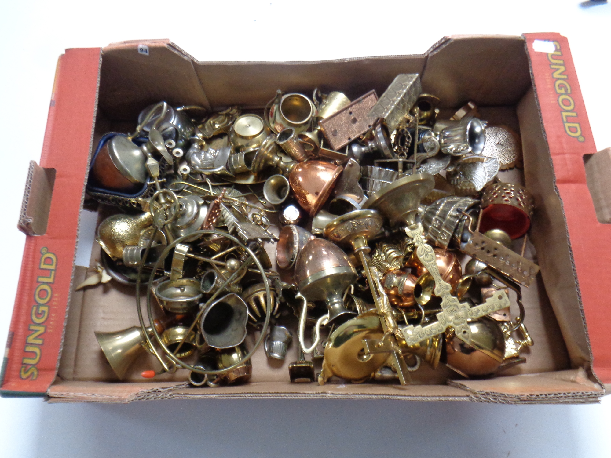 A box containing a large quantity of assorted brassware, crucifixes,