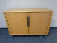 A mid 20th century Danish System B8 shutter door office stationary cabinet (no shelves)