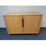 A mid 20th century Danish System B8 shutter door office stationary cabinet (no shelves)