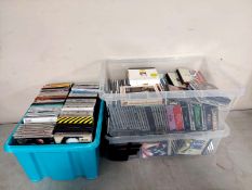 Three boxes containing a large quantity of CDs