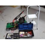 A Qualcast electric lawn mower together with a folding metal step and a toolbox with contents