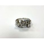 An 18ct white gold eight stone diamond ring, the total diamond weight estimated at 1.
