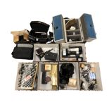 Several aluminium camera cases and bags containing photography accessories, flashes,