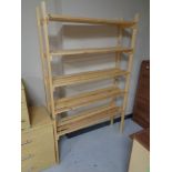 A set of pine five tier open shelves
