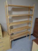 A set of pine five tier open shelves