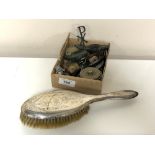 A silver backed dressing table brush together with a box containing lady's wristwatch, carvings,