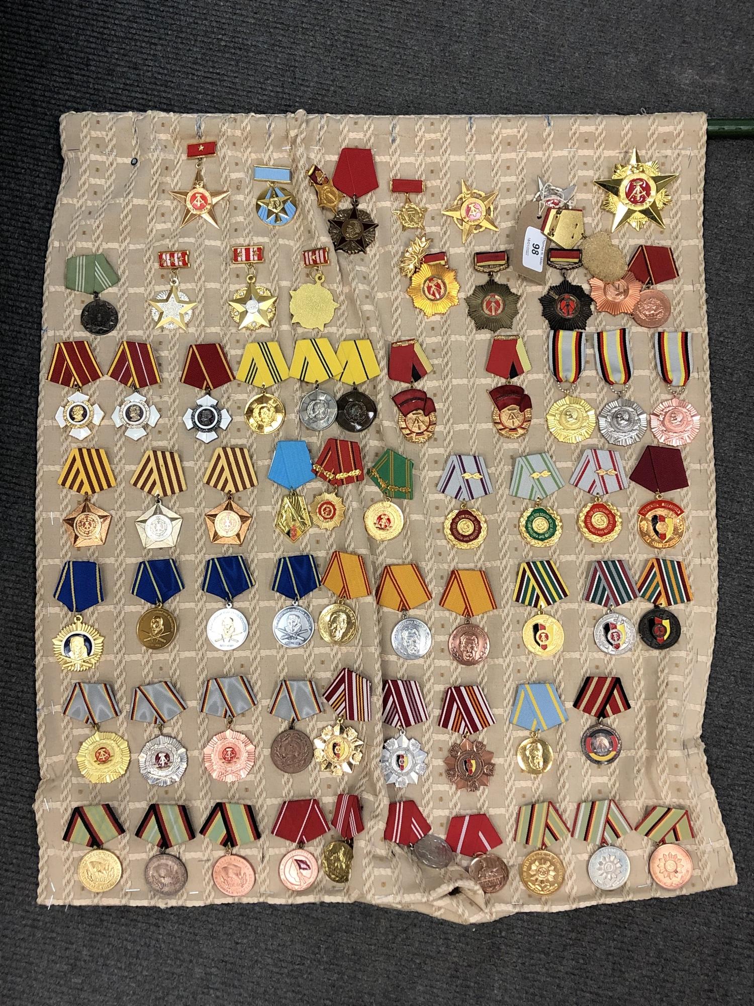 Approximately sixty-four reproduction medals and badges of Russian/ Eastern European interest (64)