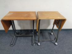 Two mid 20th century Danish teak bed tables on metal legs