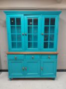 A contemporary kitchen dresser fitted cupboards and drawers beneath