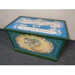 A painted blanket chest with Jethro Burdock and Sons advertising decoration to top,