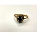 An 18ct gold sapphire and diamond cluster ring, size O.