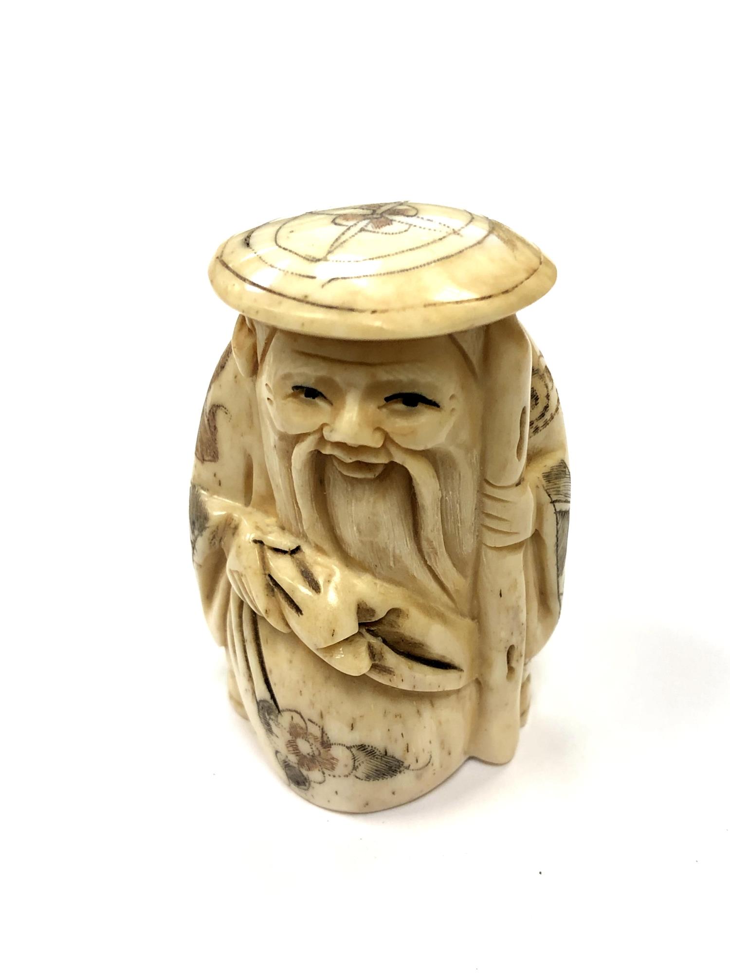 A Chinese bone netsuke - A Village Elder Wearing a Flat Hat.