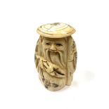 A Chinese bone netsuke - A Village Elder Wearing a Flat Hat.