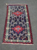 A Turkish woolen fringed rug,