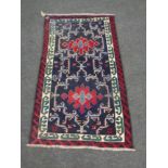 A Turkish woolen fringed rug,